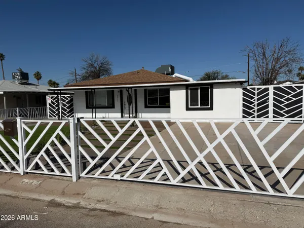a front view of a house with parking space and a yard