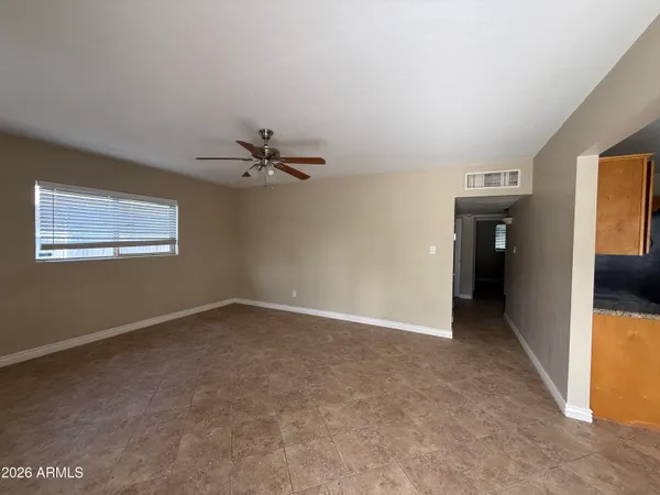 a view of an empty room with a window