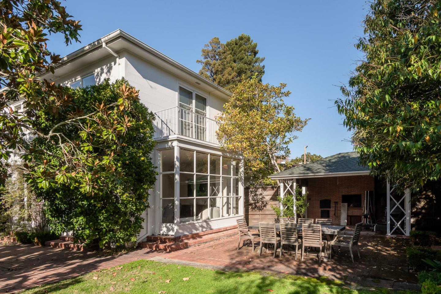 405 Chapin Lane Burlingame, CA 94010 - Photo 11 of 18 a view of a chair and table in backyard of the house