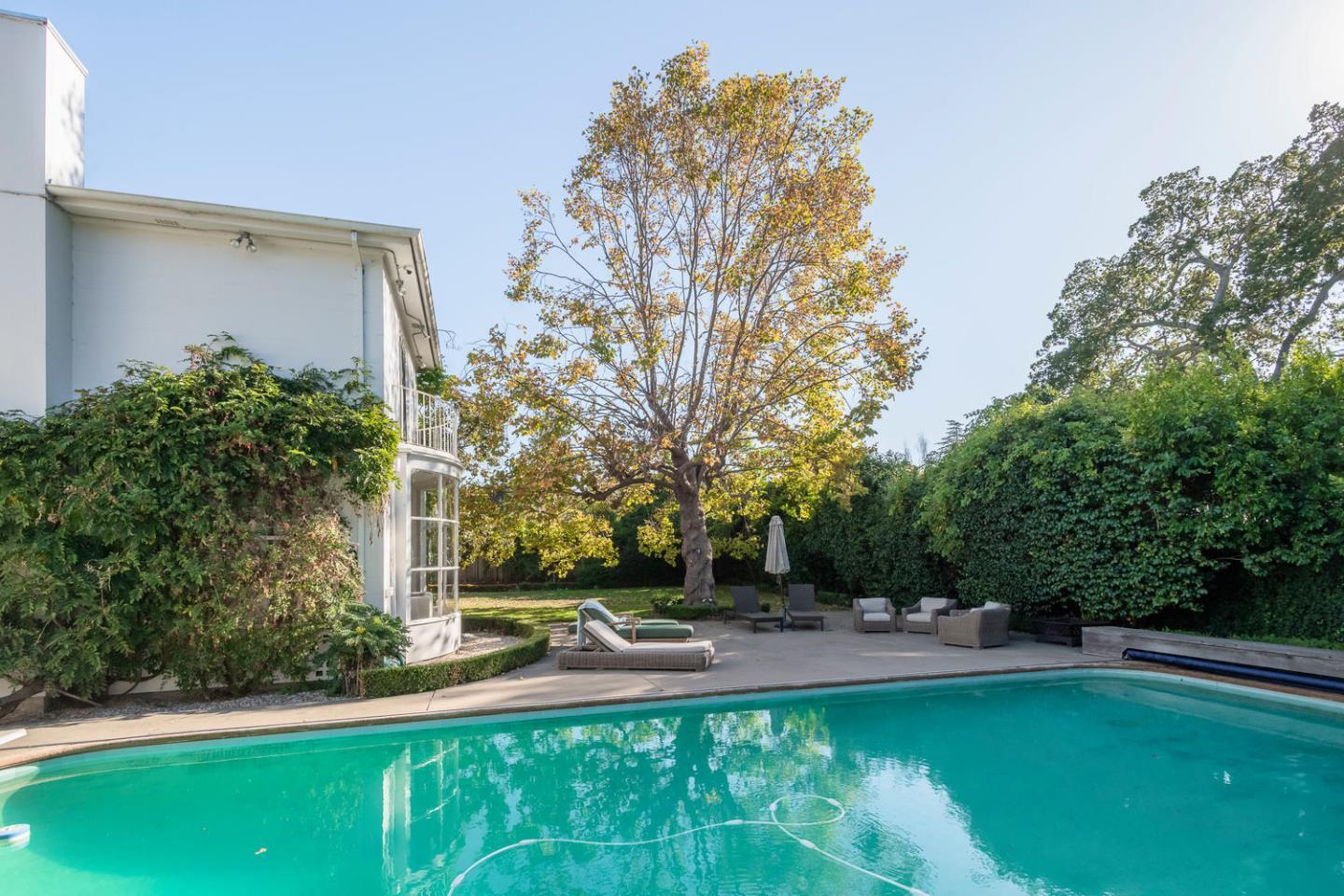 405 Chapin Lane Burlingame, CA 94010 - Photo 16 of 18 a view of a swimming pool with a patio
