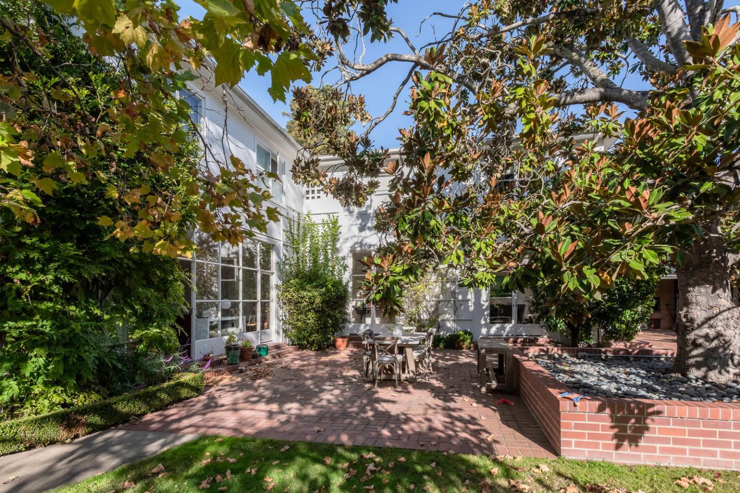 405 Chapin Lane Burlingame, CA 94010 - Photo 17 of 18 a view of a patio with table and chairs and potted plants