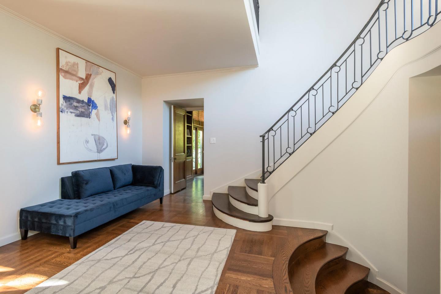 405 Chapin Lane Burlingame, CA 94010 - Photo 2 of 18 a living room with furniture and a stair