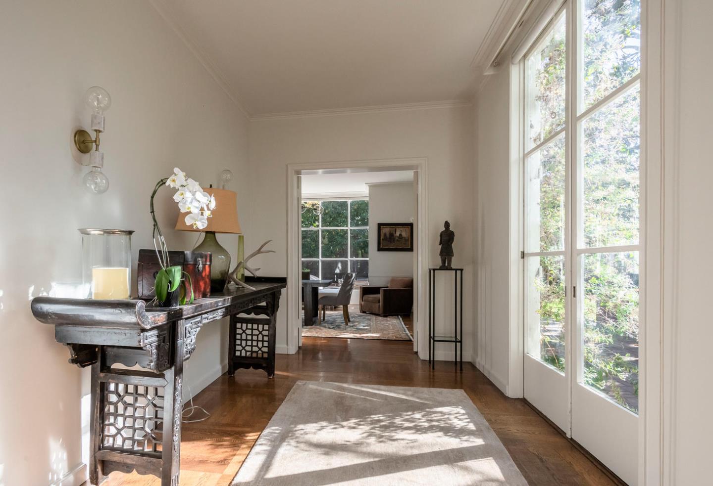 405 Chapin Lane Burlingame, CA 94010 - Photo 5 of 18 a living room with furniture a chandelier and a fireplace