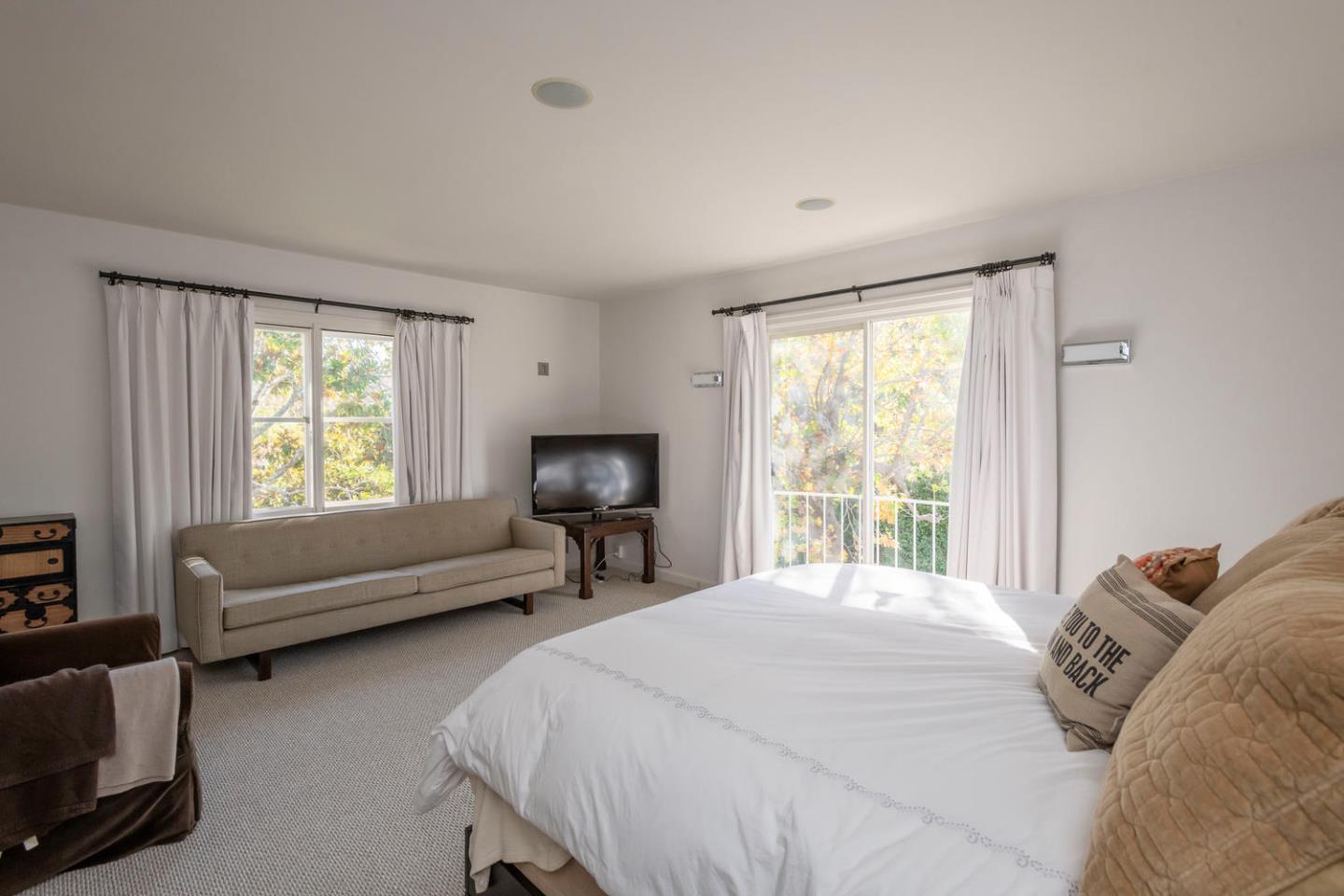 405 Chapin Lane Burlingame, CA 94010 - Photo 9 of 18 a bedroom with a bed a couch and a window