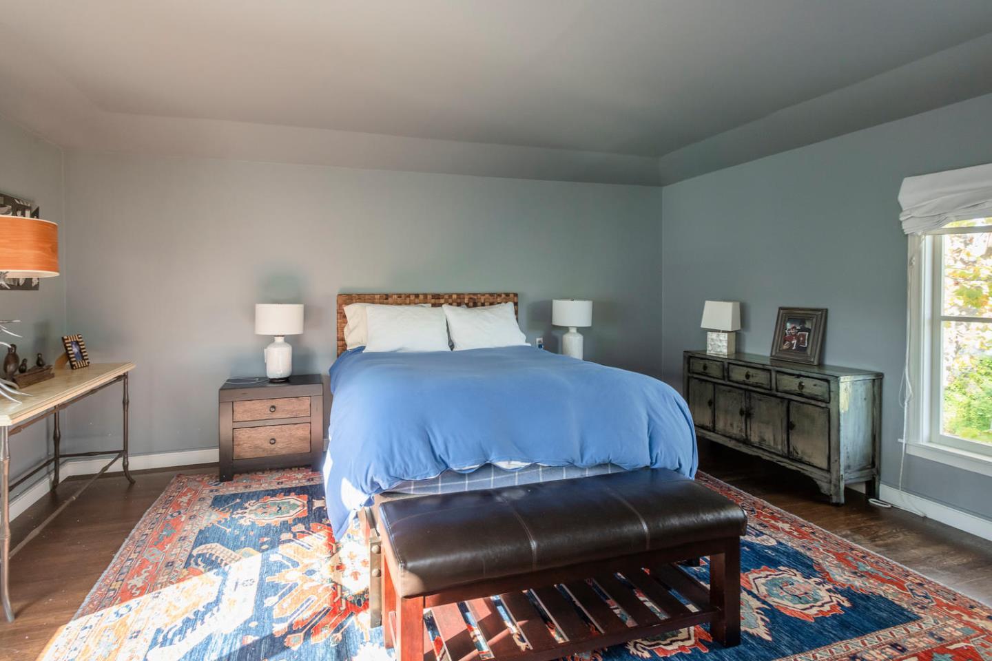 405 Chapin Lane Burlingame, CA 94010 - Photo 10 of 18 a bedroom with a bed and wooden floor