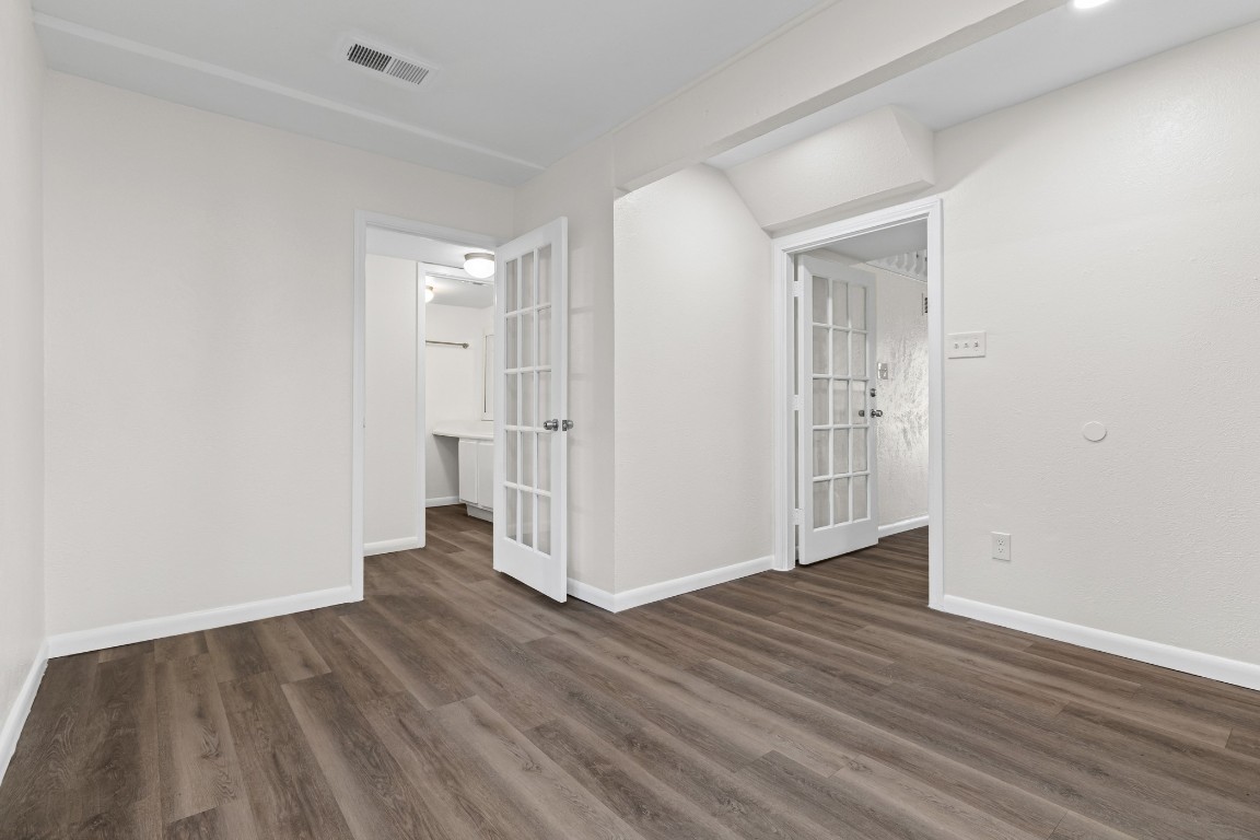 1713 Cinnamon Path, Unit B Austin, TX 78704 - Photo 11 of 32 wooden floor in an empty room