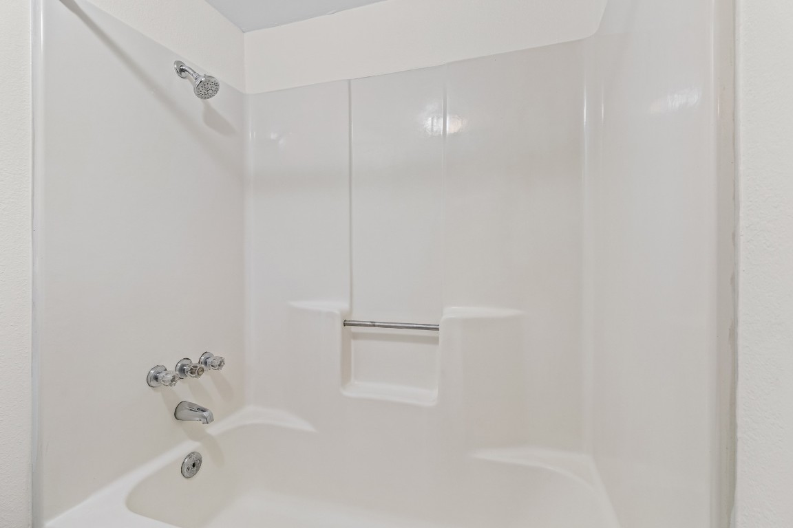 1713 Cinnamon Path, Unit B Austin, TX 78704 - Photo 19 of 32 a bathroom with a bathtub