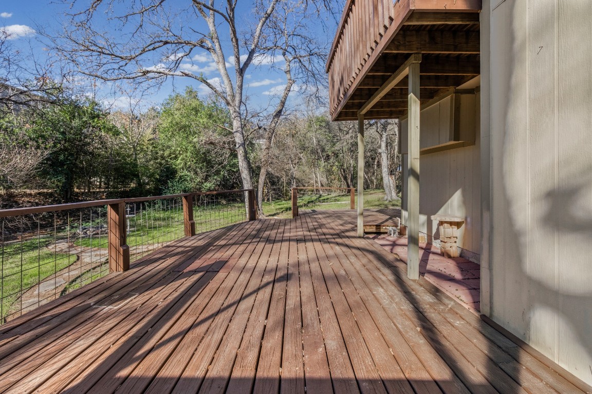 1713 Cinnamon Path, Unit B Austin, TX 78704 - Photo 25 of 32 a view of balcony with wooden floor and fence