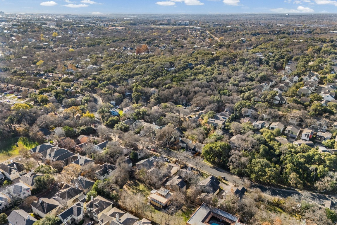 1713 Cinnamon Path, Unit B Austin, TX 78704 - Photo 30 of 32 an aerial view of house with yard and mountain view in back
