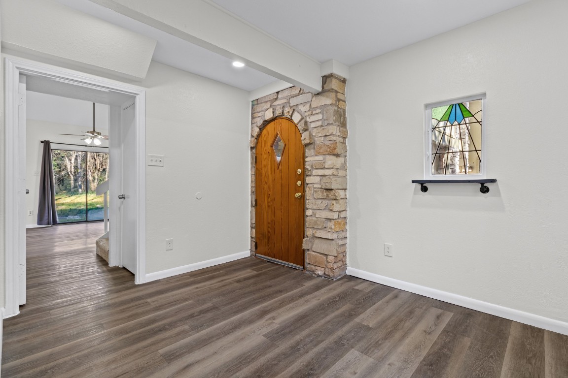 1713 Cinnamon Path, Unit B Austin, TX 78704 - Photo 3 of 32 an empty room with wooden floor and windows