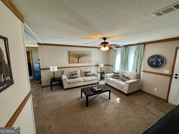 a bedroom with a bed and a couch