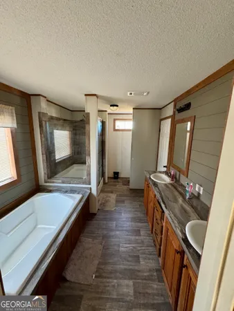 a room with wooden floor and furniture