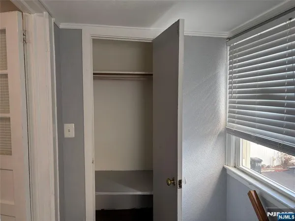a view of walk in closet with window