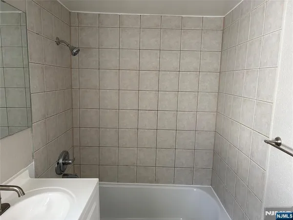 a bathroom with a sink and bathtub