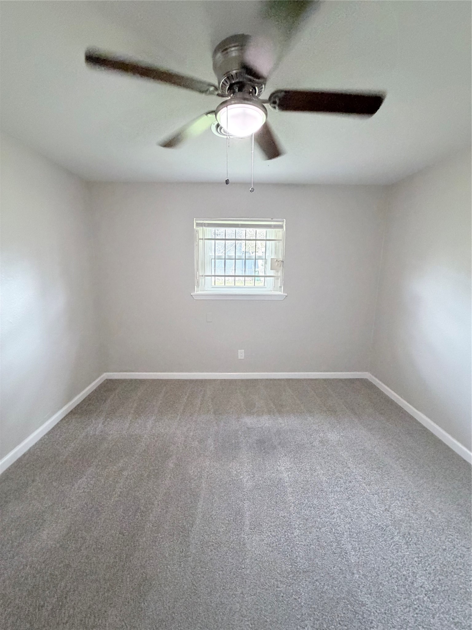 7705 Parker Road Houston, TX 77016 - Photo 13 of 17 a view of an empty room with a window