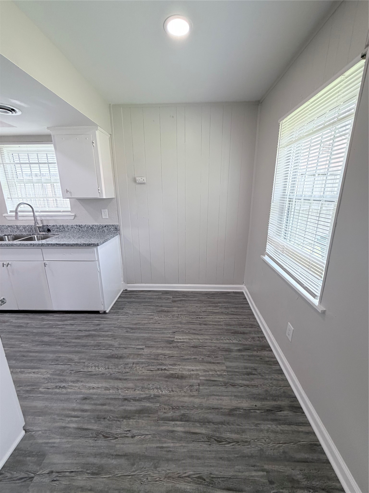 7705 Parker Road Houston, TX 77016 - Photo 7 of 17 a view of a kitchen with a sink and dishwasher wooden floor