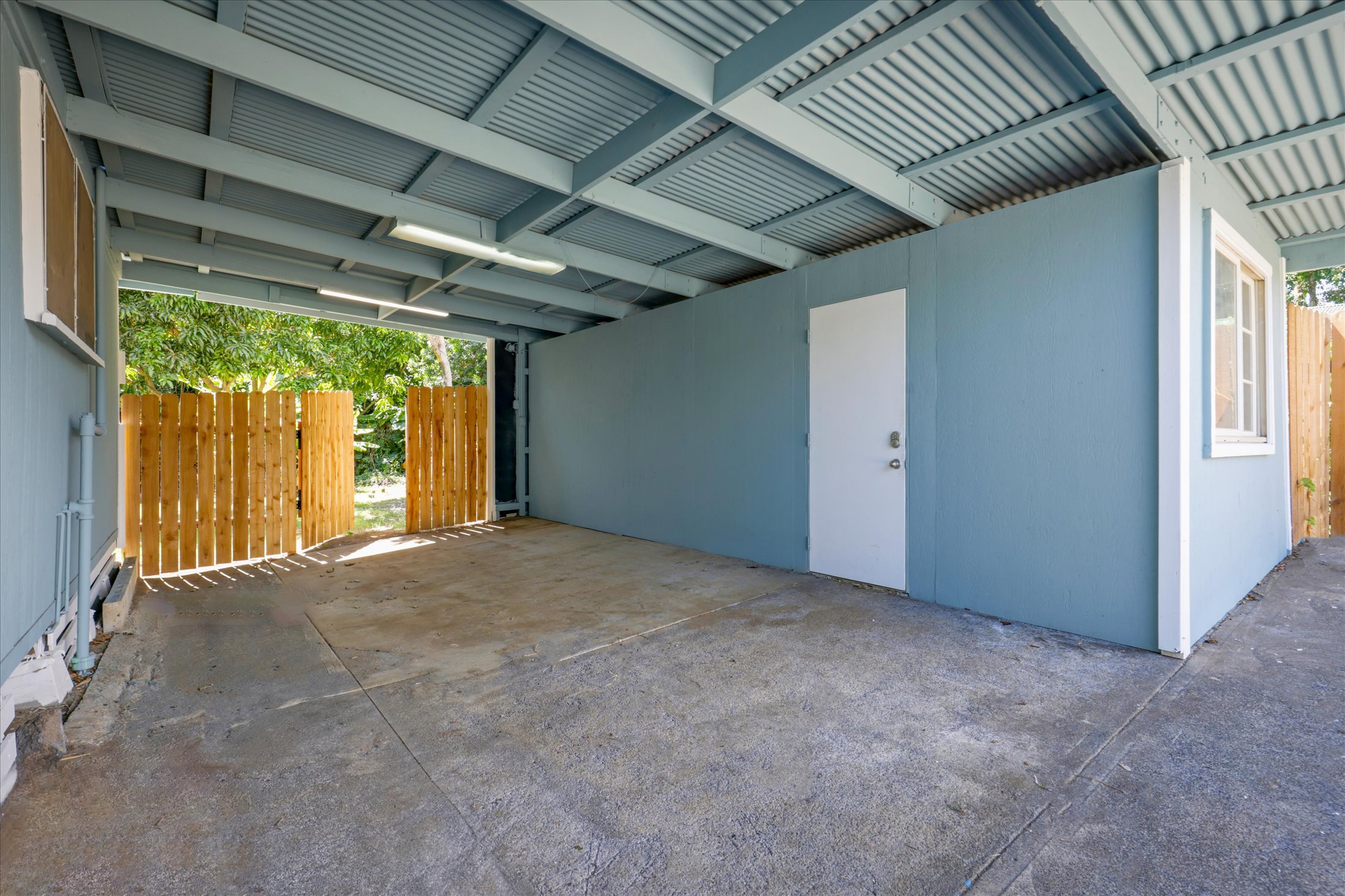 55-545 Hawi Road Hawi, HI 96719 - Photo 21 of 27 a view of empty room with wooden floor and windows