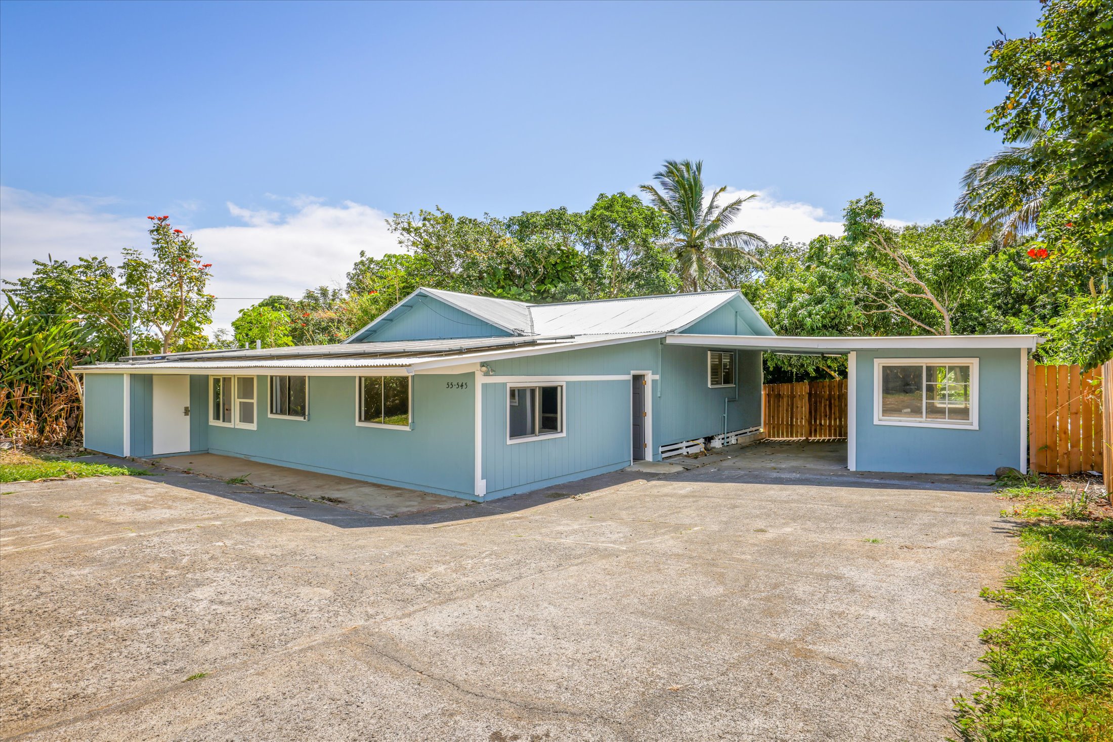 55-545 Hawi Road Hawi, HI 96719 - Photo 3 of 27 a front view of house with yard and trees in the background