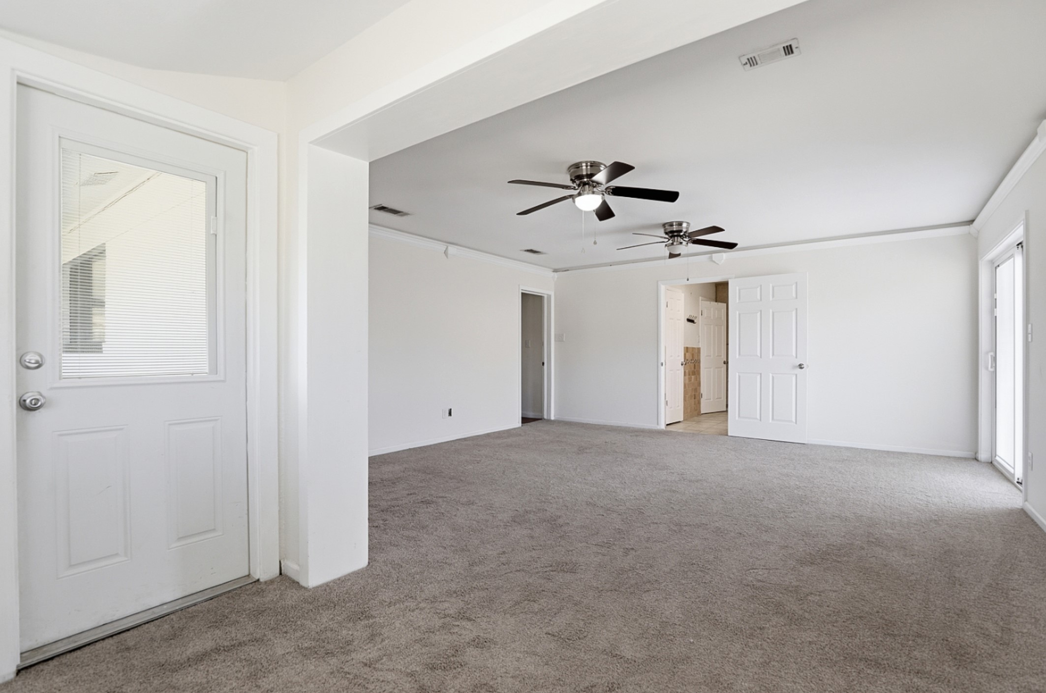 128 Skyview Terrace Leander, TX 78641 - Photo 12 of 23 2nd view. Unfurnished Primary bedroom with light carpet and crown molding. Primary features bonus space.