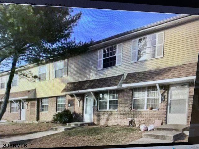 720 South New Road, Unit 2M Absecon, NJ 08201 - Photo 1 of 3 a front view of a house with plants