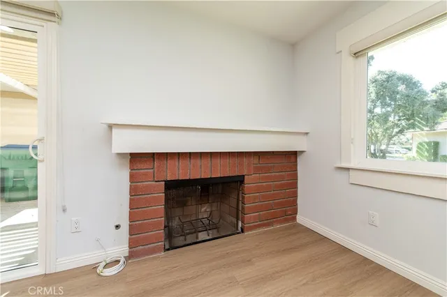 a kitchen with stainless steel appliances granite countertop wooden cabinets a refrigerator a stove a sink and a microwave