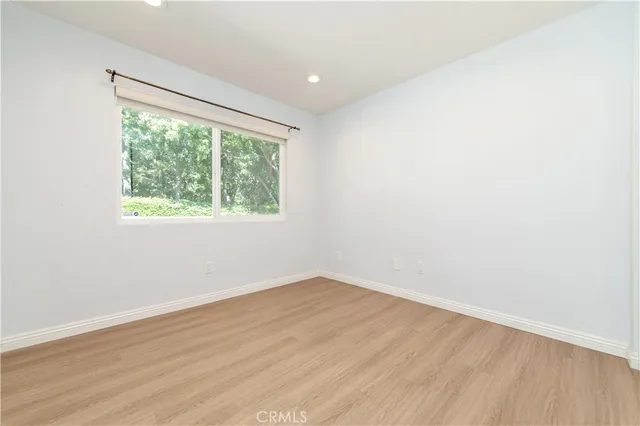 a bathroom with a sink a toilet a mirror and vanity