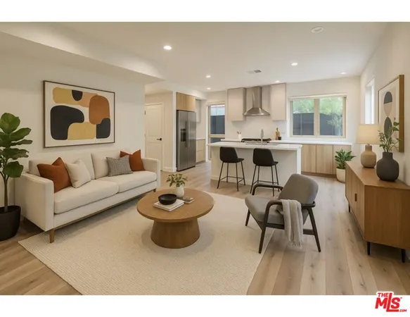 a living room with furniture and a dining table