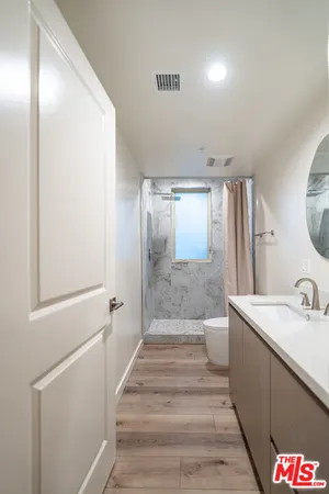 a bathroom with a sink and mirror