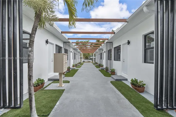 a view of a house with yard and garden