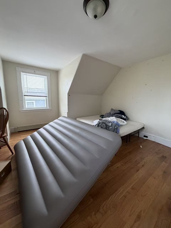 35 Fiske Street, Unit 3 Waltham, MA 02451 - Photo 3 of 6 a bedroom with a bed and window