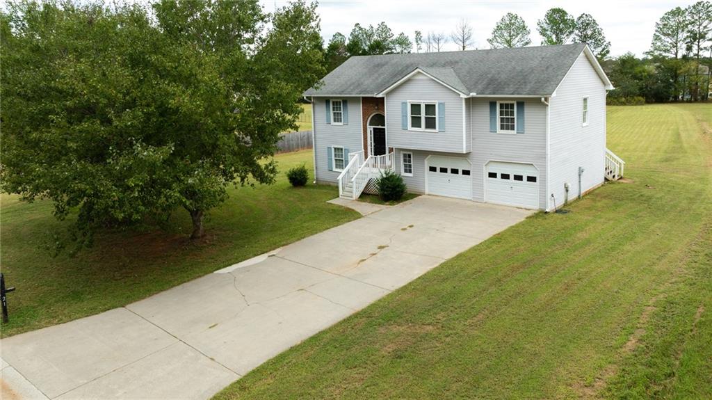 21 Misty Ridge Drive Euharlee, GA 30145 - Photo 1 of 1 a front view of a house with garden