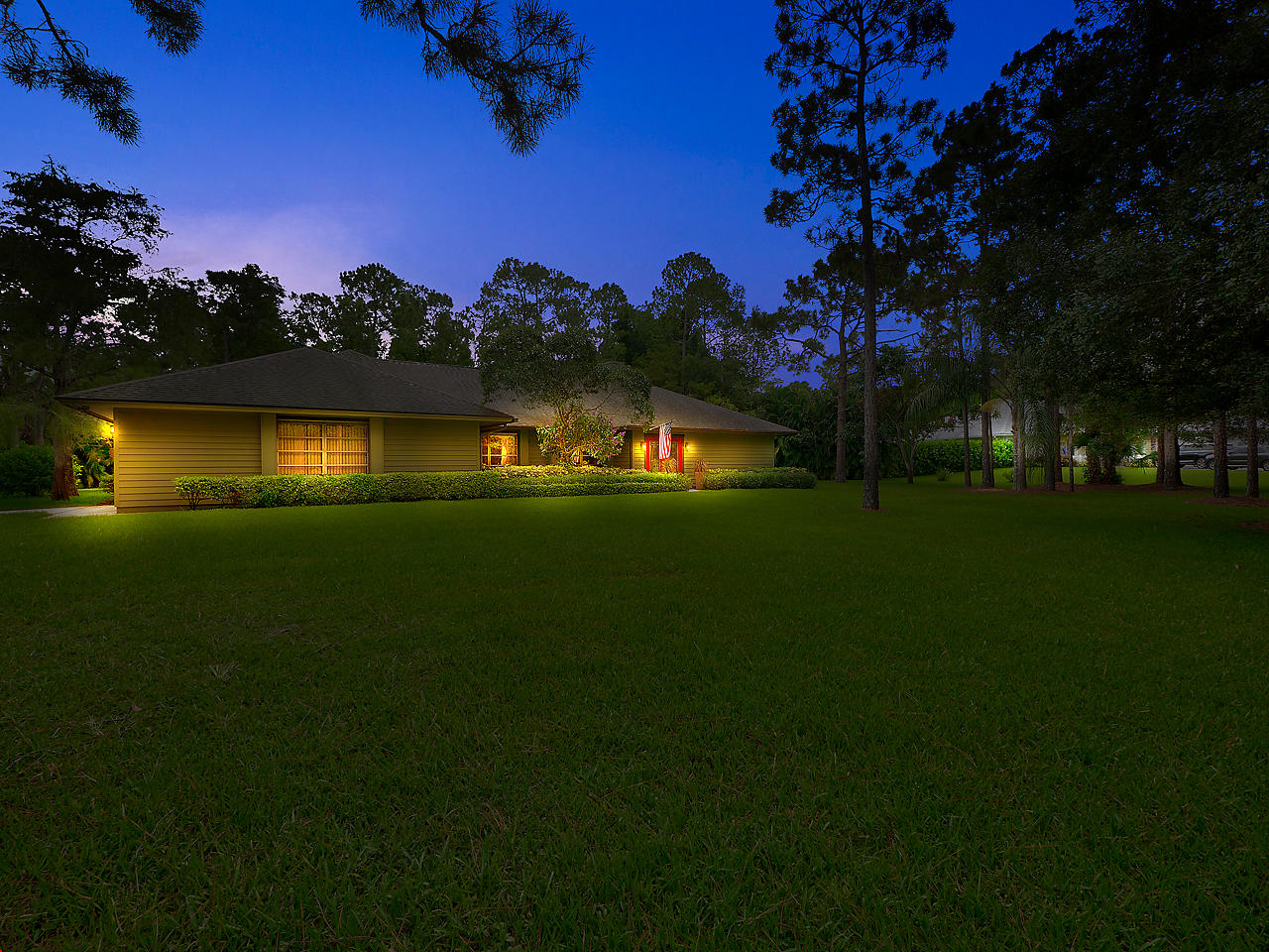 10409 Trailwood Circle Jupiter, FL 33478 - Photo 2 of 43 Front-Twighlight