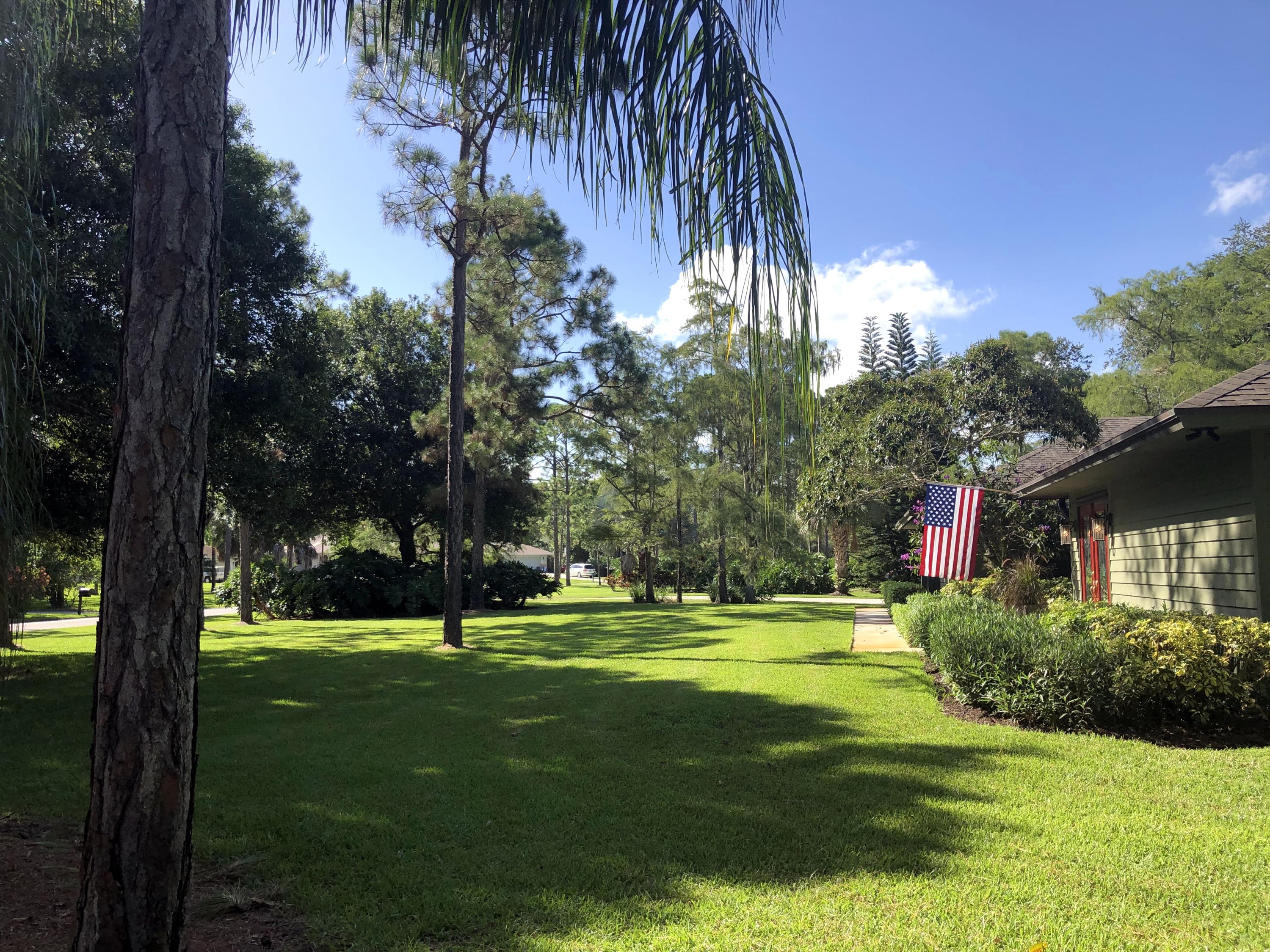 10409 Trailwood Circle Jupiter, FL 33478 - Photo 4 of 43 FrontYard2