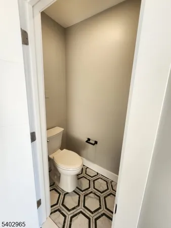 a bathroom with a toilet and a sink