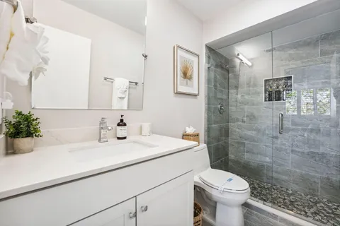 a bedroom with a bed and flat screen tv