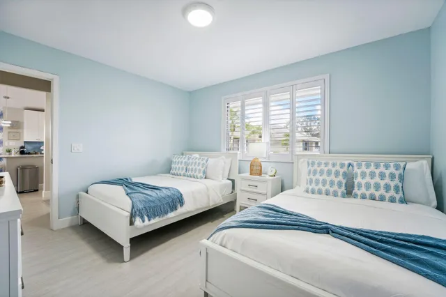 an aerial view of a house with garden space and lake view