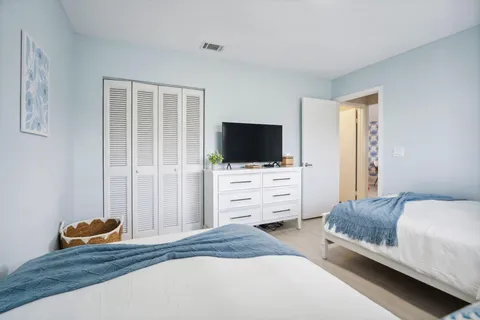 a view of a patio with table and chairs near a yard