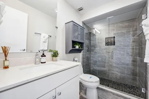 a view of a chairs and table in patio with a lake view