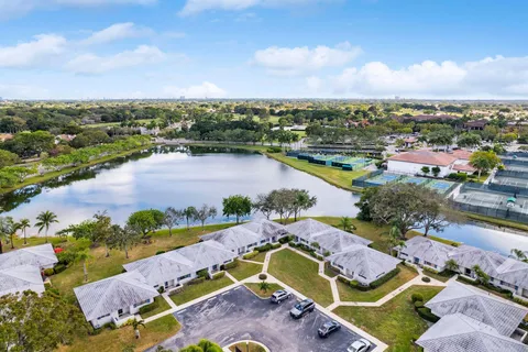 an aerial view of a houses with a lake view