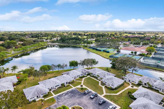 an aerial view of a houses with a lake view