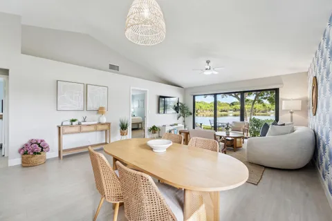 a view of living room with granite countertop furniture and a large window