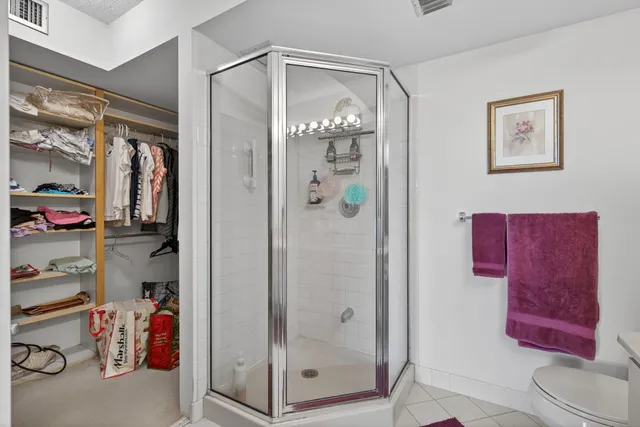 a bathroom with a mirror shower and a sink