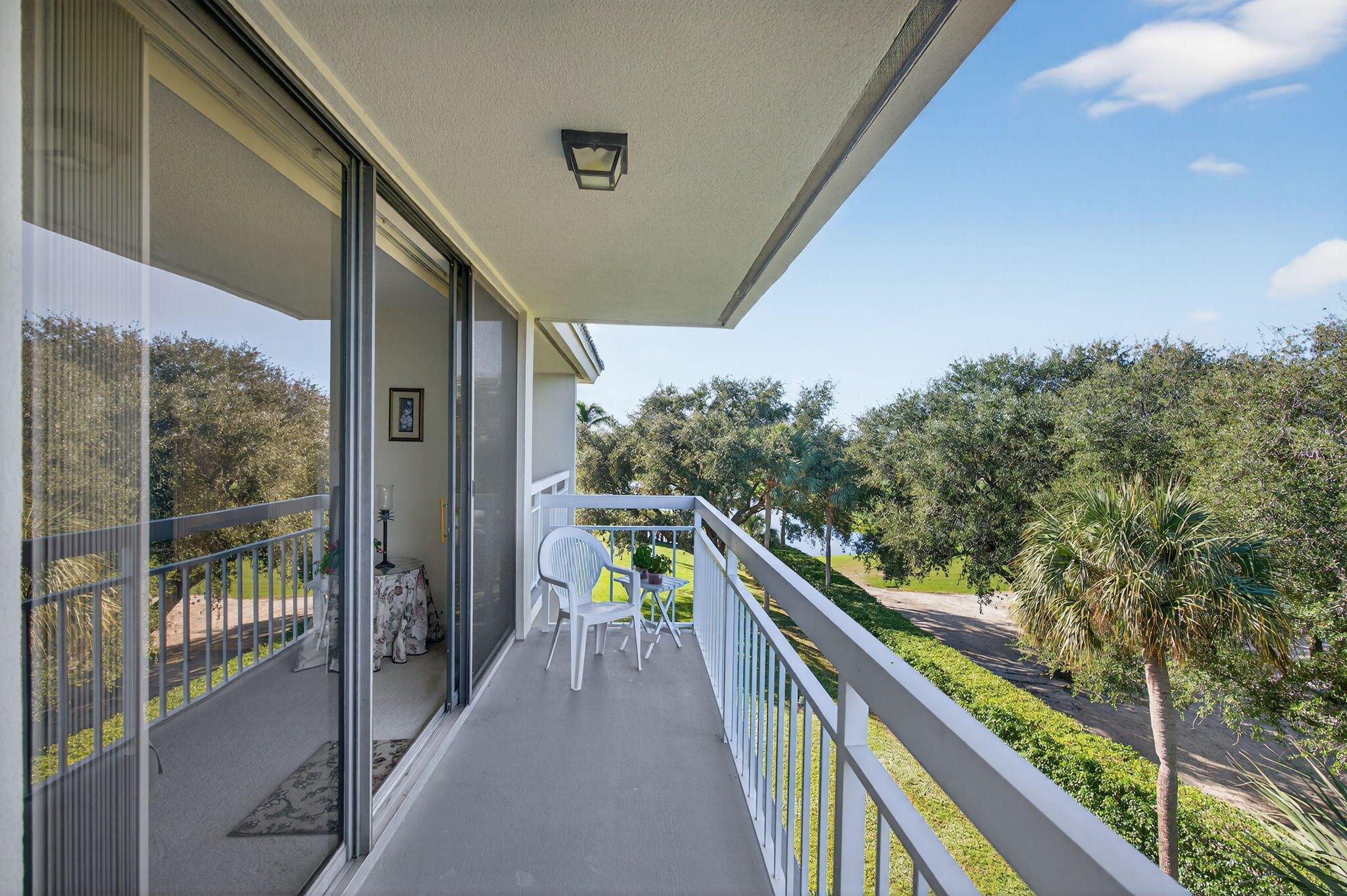 2581 Village Boulevard, Unit 401 West Palm Beach, FL 33409 - Photo 22 of 24 a view of balcony and yard