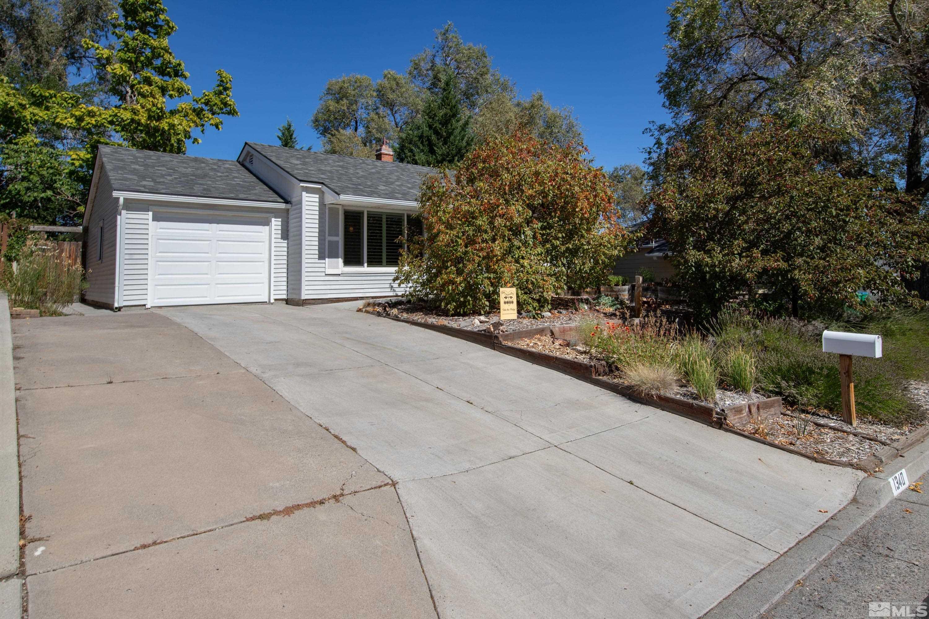 1340 Wesley Drive Reno, NV 89503 - Photo 1 of 39 a view of a house with backyard and trees