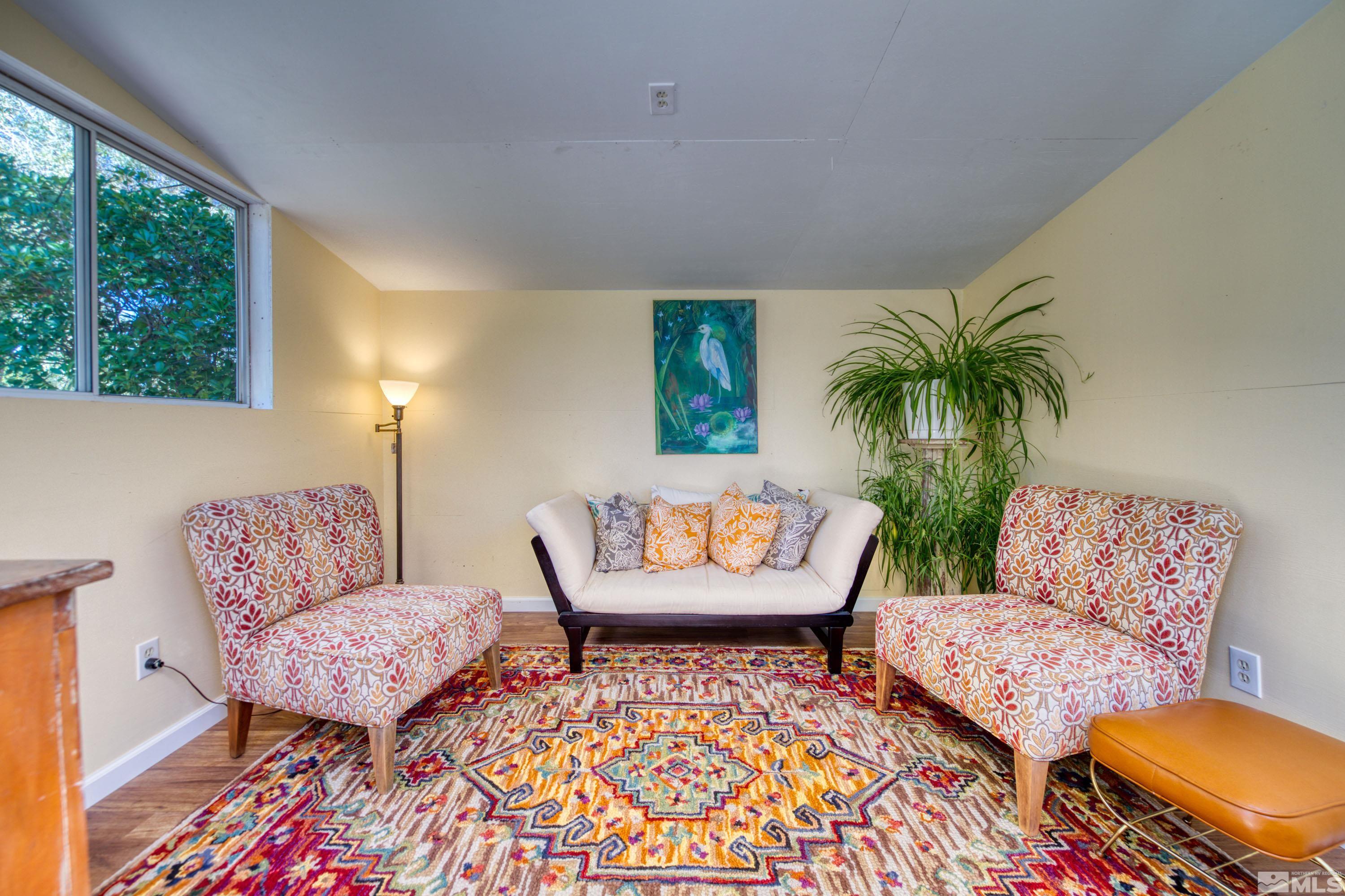 1340 Wesley Drive Reno, NV 89503 - Photo 29 of 39 a living room with furniture and a rug