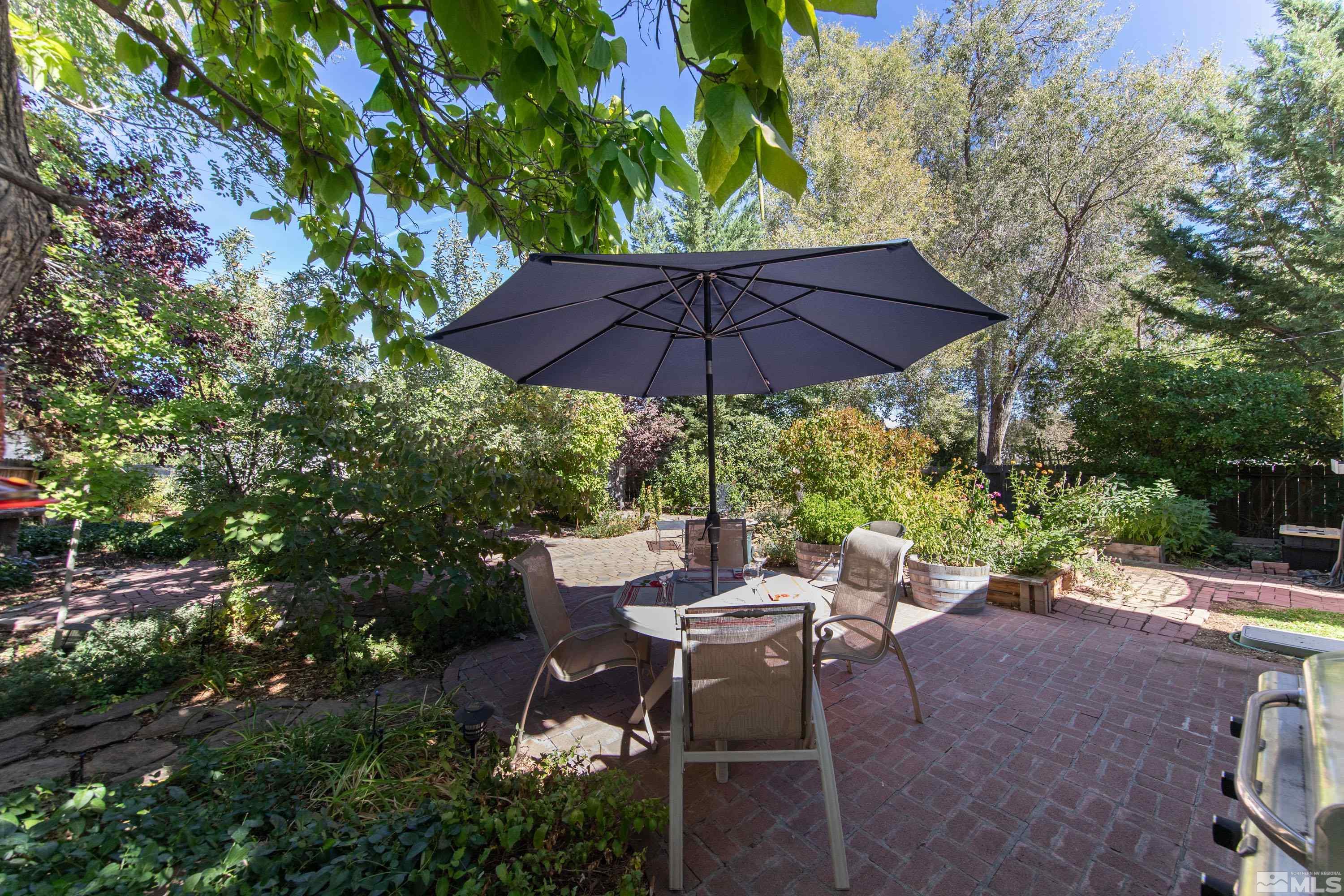 1340 Wesley Drive Reno, NV 89503 - Photo 34 of 39 a view of a patio with chairs and a small yard