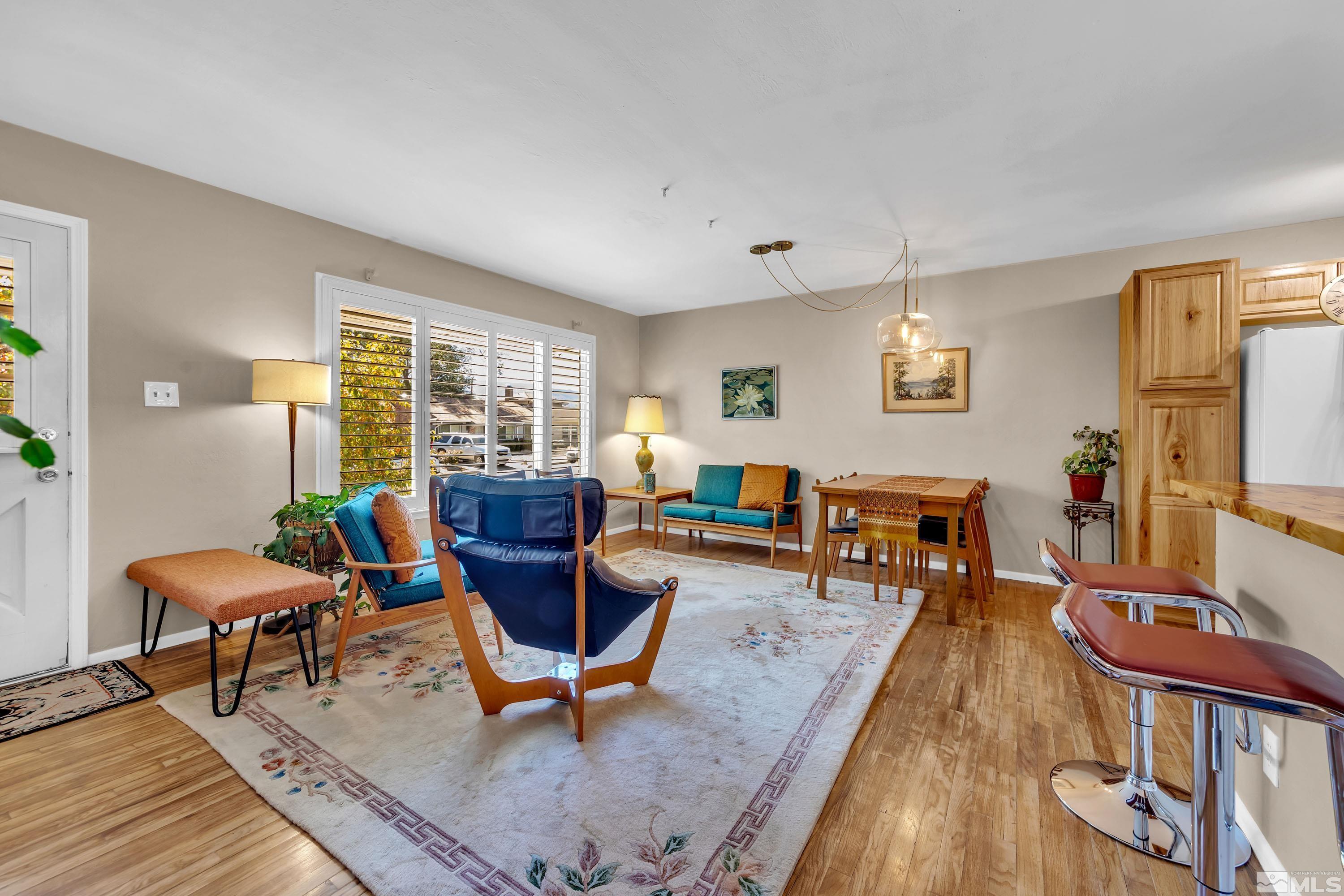 1340 Wesley Drive Reno, NV 89503 - Photo 6 of 39 a living room with furniture a rug and a large window