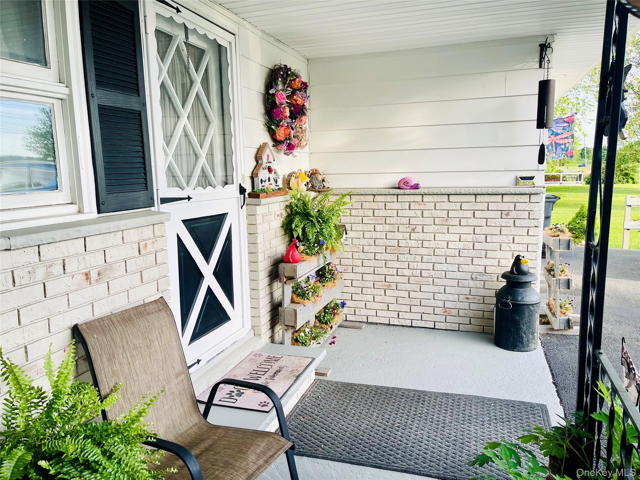 137 Cross Road Goshen, NY 10924 - Photo 3 of 50 a view of a patio with table and chairs potted plants