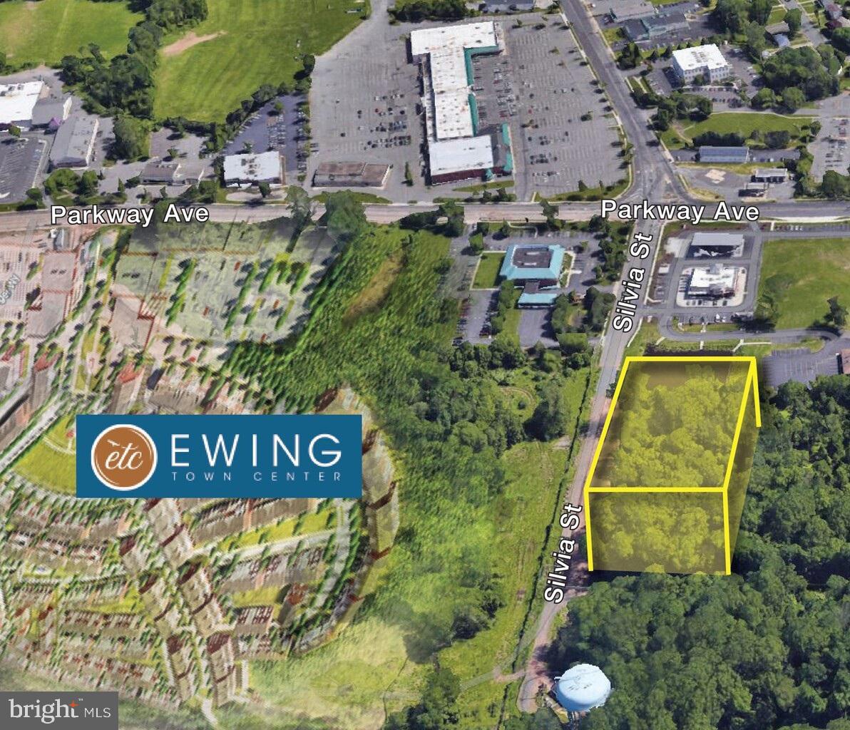 1200 Silvia Street Ewing, NJ 08628 - Photo 3 of 3 an aerial view of a house with swimming pool and red chairs