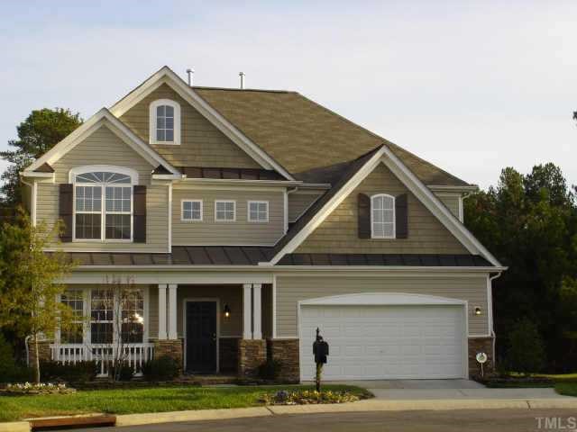 5412 Glass Ridge Road Raleigh, NC 27616 - Photo 1 of 12 a front view of a house with a yard